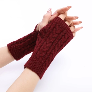Detail of cable knit pattern on burgundy fingerless arm warmers for winter style
