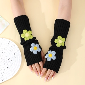 Detail of Y2K knitted arm warmers with 3D floral embroidery and ribbed texture