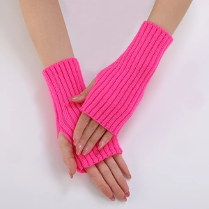 Detail of hot pink ribbed knit fingerless gloves with thumb hole on a white background