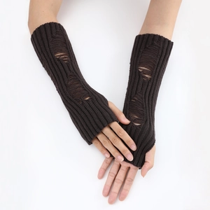Detailed knit texture of dark coffee arm warmers with vintage distressed holes
