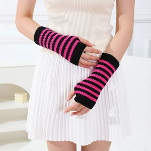 Detail of pink and black striped knit fingerless gloves showing fabric texture and fit