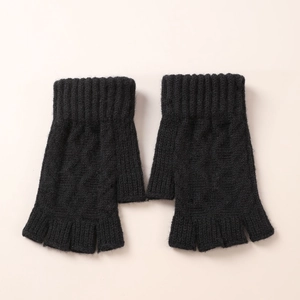 Close-up of black cable knit arm warmers with ribbed cuffs and fingerless design