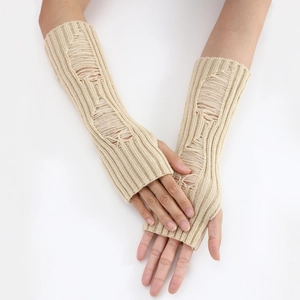 Close-up of beige knitted arm warmers with distressed hole design for a stylish look
