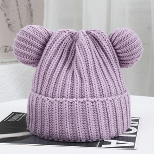 Detail of lavender knit beanie with plush bear ears and chunky ribbed texture for winter