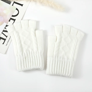 Detail of white cable knit arm warmers featuring ribbed cuffs and soft woolen texture