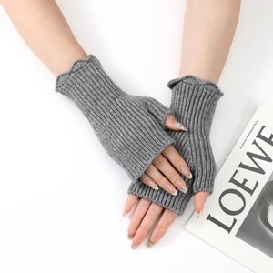 Close-up of grey ribbed knit fingerless gloves with elegant lettuce edge trim detail