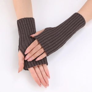 Detail of dark brown ribbed knit fingerless gloves showing textured wrist arm warmers