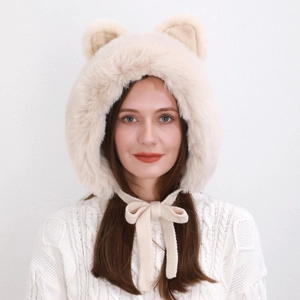 Front view of a plush beige winter hat with cute ears and long soft chin straps