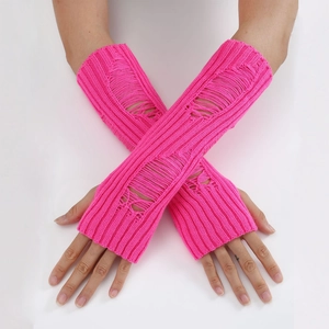 Detail of bright pink distressed knit arm warmers with trendy ripped hollow texture
