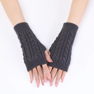 Close-up detail of dark grey cable knit pattern on these stylish fingerless arm warmers