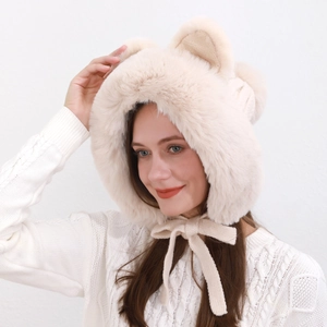 Close-up of plush faux fur winter hat with cute fox ears and thick ribbon bow detail