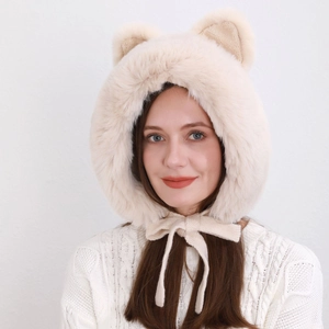Detailed texture of beige plush bear ear winter hat with cozy chin straps for women