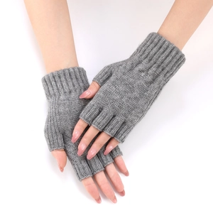 Close-up of grey knit fingerless gloves for women with long ribbed cuffs for winter
