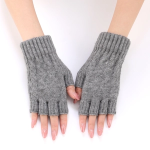 Close-up of gray knit fingerless gloves showing ribbed cuffs and soft wool texture