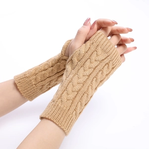 Detailed cable knit pattern on camel-colored winter arm warmers for women