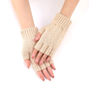 Close-up of beige knit arm warmers showing detailed rib texture and fingerless design