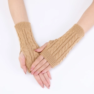 Close-up of khaki cable knit arm warmer showing thumb hole and chunky textured weave