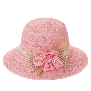Women's pink woven sun hat with floral silk flower and checkered bow decoration