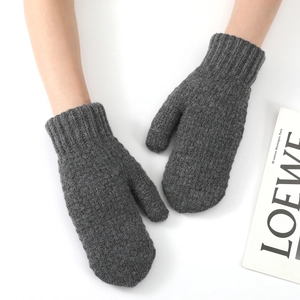 Detailed close-up of dark grey knitted mittens featuring thick fleece lining and ribbed cuffs