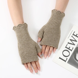 Macro detail of khaki ribbed knit fingerless gloves featuring stylish ruffle edge cuffs