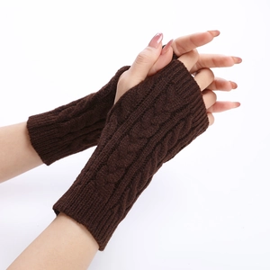 Close-up of dark brown cable knit fingerless arm warmers showing thick braided texture