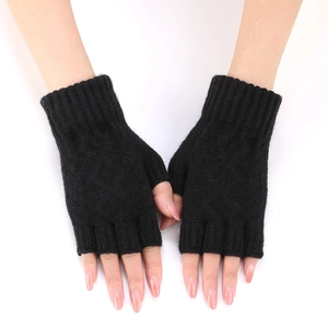 Close-up of black knitted fingerless gloves with ribbed cuffs and soft texture