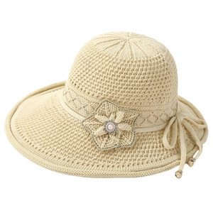 Elegant beige knit sun hat for elderly women with decorative flower and pearl accent