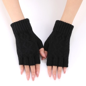 Close-up of black knit arm warmers featuring ribbed cuffs and thumb hole design