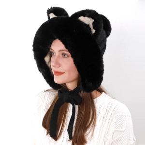 Detail of plush black fox ear winter hat with soft faux fur texture and tie straps