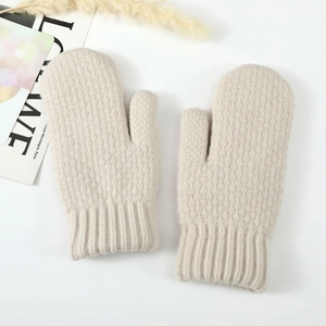 Close-up of thick beige knit mittens with warm thermal lining and ribbed elastic cuffs