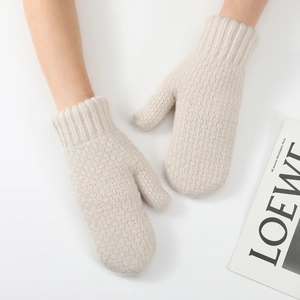 Detail of beige knit mittens with thick fleece lining and ribbed wrist cuffs