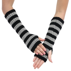 Detail of black and gray striped knitted fingerless gloves with functional thumb holes