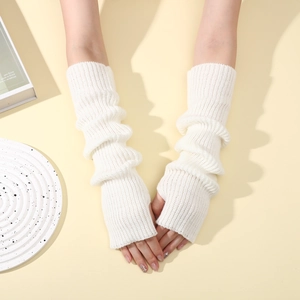 Close-up of cream white ribbed knit fingerless arm warmers with soft texture detail