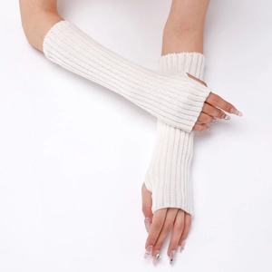 Close-up of white ribbed knit fingerless arm warmers with detailed woven texture