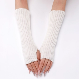 Close-up of white knitted arm warmer with ribbed texture and thumb hole detail