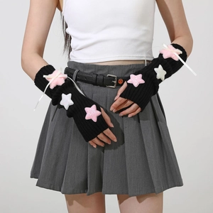 Detail of Y2K knit arm warmers with plush sequins stars and delicate white ribbon bows