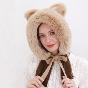 Detail of plush camel hood with bear ears and knitted ties for winter warmth