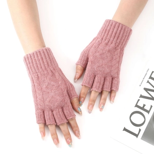 Close-up of pink knit fingerless arm warmers showing soft cashmere texture and ribbed cuffs