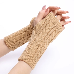Women's camel cable knit arm warmers featuring rib-knit cuffs and fingerless design