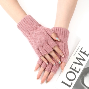 Close-up of pink knitted fingerless gloves with ribbed cuffs and soft wool texture