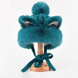 Winter plush fox ear knit hat in teal with faux fur trim and fluffy pompoms for warmth