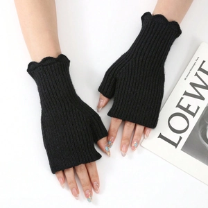 Black knitted fingerless gloves for women with ruffled edges and ribbed texture