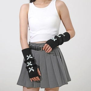 Detail of black knit arm warmers with blue ribbon bows for Y2K Lolita JK style outfits