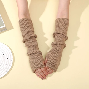 Detailed texture of brown ribbed knit arm warmers in a stylish layered sleeve style