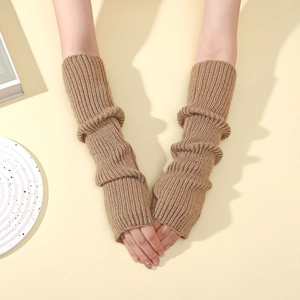 Close-up of khaki ribbed knit arm warmers with fingerless holes in a cozy winter style