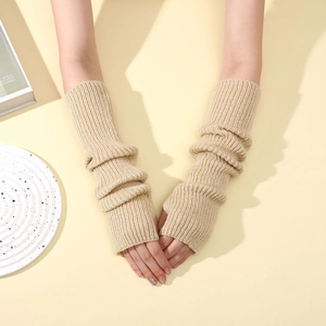 Close-up of beige ribbed knit arm warmers showing texture and fingerless design