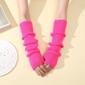 Close-up of bright pink knitted fingerless arm warmers with a ribbed texture and slouchy style