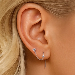 Close-up of S925 sterling silver tassel earring with moissanite flower and delicate chain
