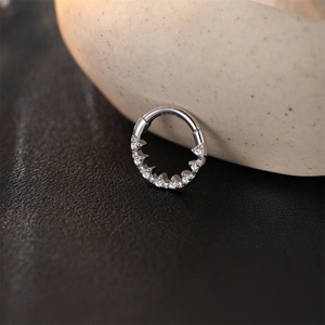 Macro shot of S925 sterling silver clicker earring with seven cubic zirconia stones