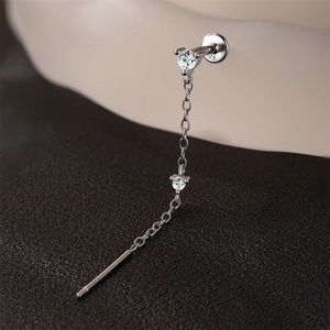 Detail of S925 sterling silver cartilage stud with a long tassel chain and stud engraving
